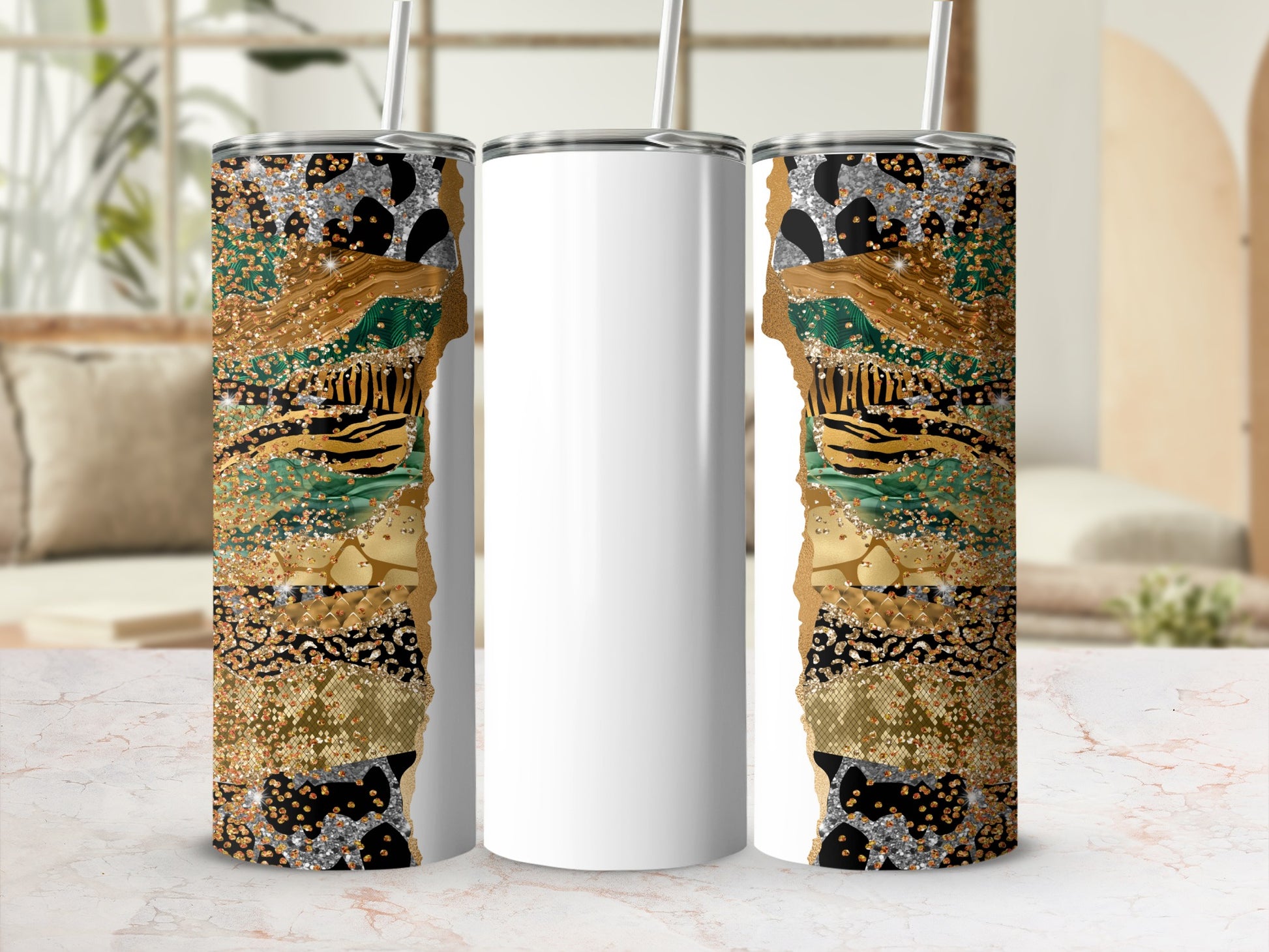 Three tumblers with glitter and animal print patterns, two with straws.