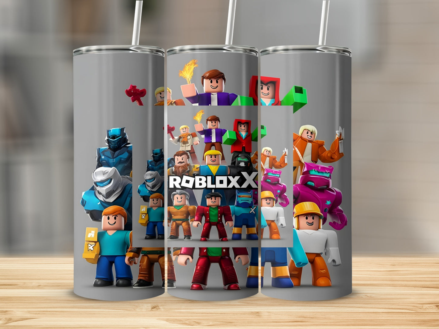 Roblox characters and "ROBLOX" logo on a gray tumbler.