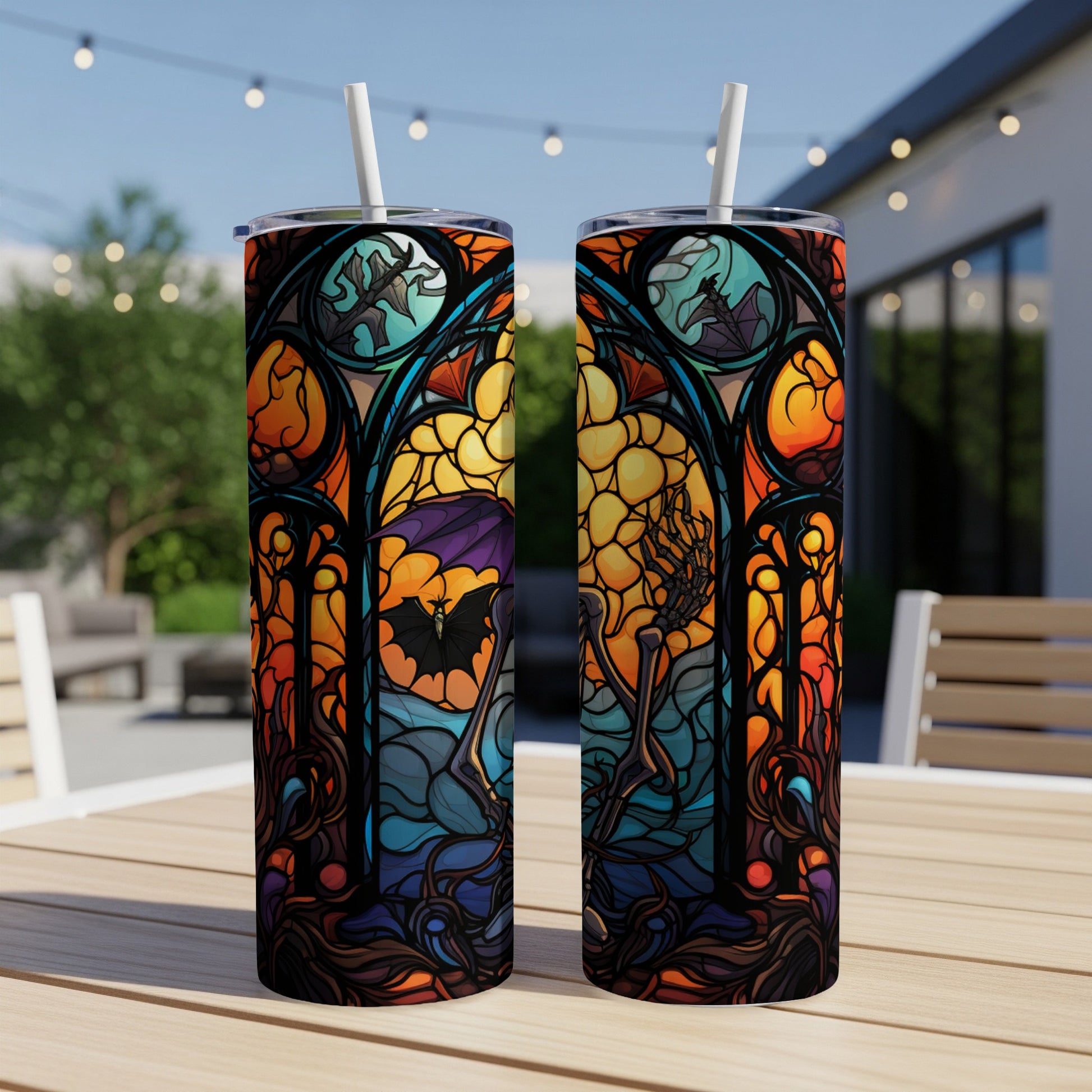 Halloween stained glass design tumbler with bat and skeleton.