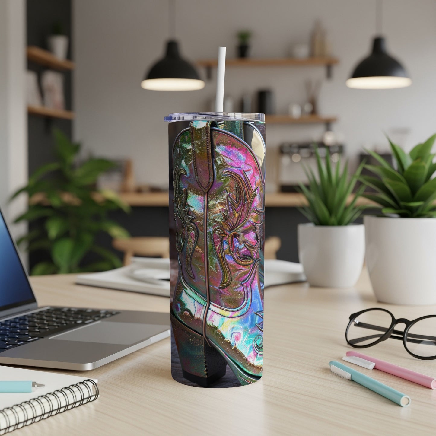 Iridescent cowboy boot design on a stainless steel tumbler with a straw.