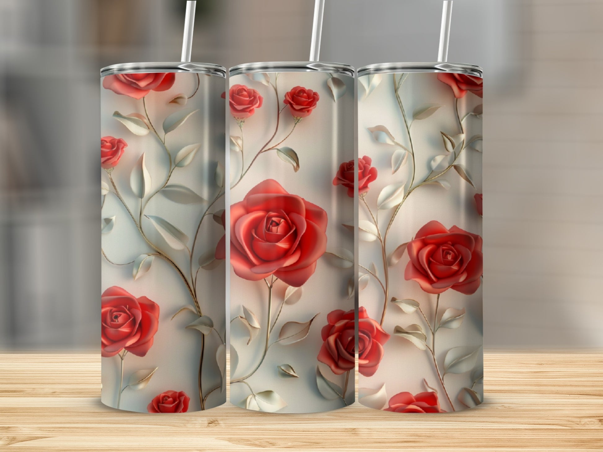 Three tumblers with a red rose and vine pattern.
