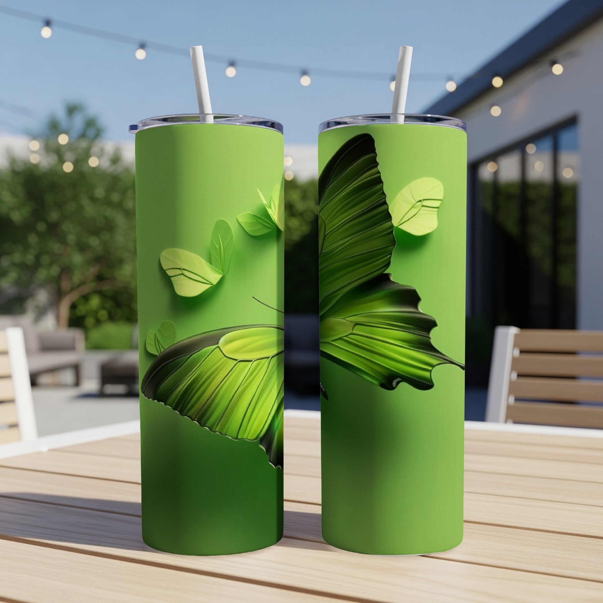 Green tumbler with butterfly wing design.