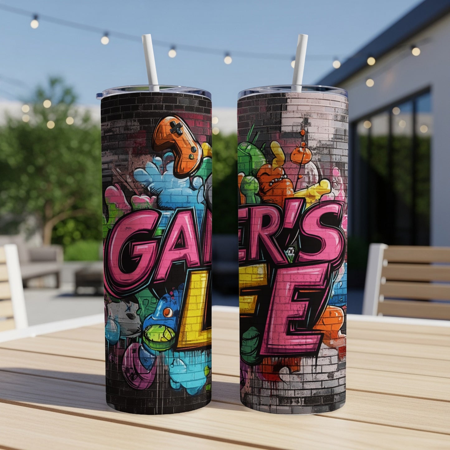 Two tumblers with "Gamer's Life" graffiti art and cartoon monsters.