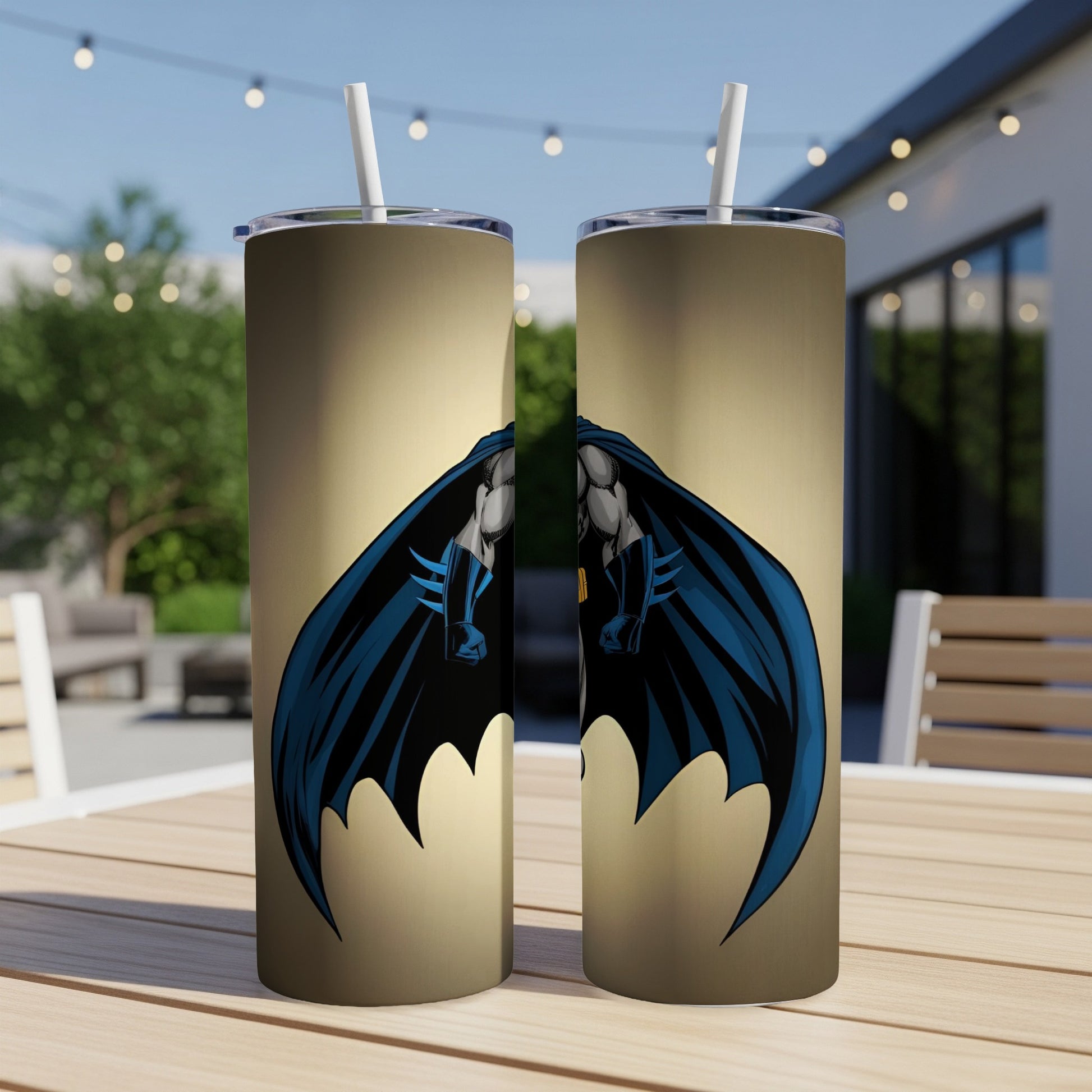 Two tall tumblers with Batman's cape and cowl design on a golden background.