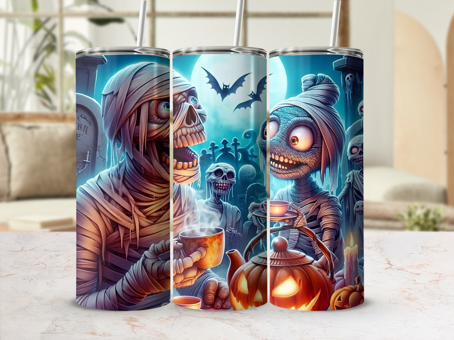 Halloween tumblers with mummies, skeletons, bats, and pumpkins on a graveyard scene.