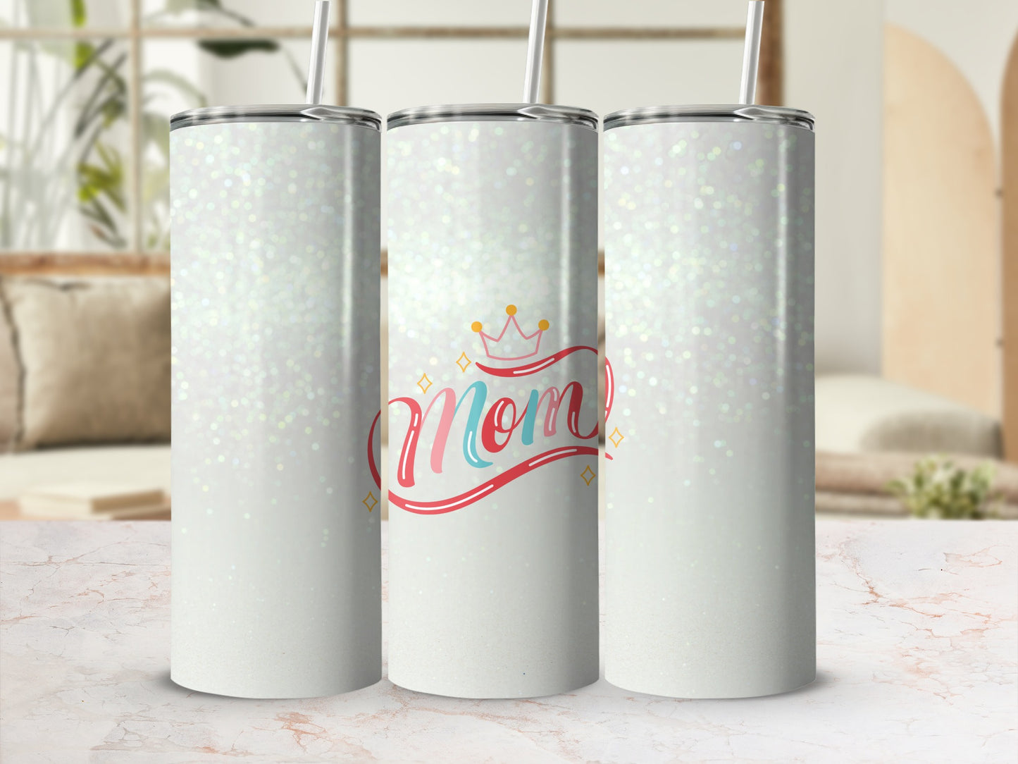 Three white glitter tumblers with "Mom" text and crown graphic.