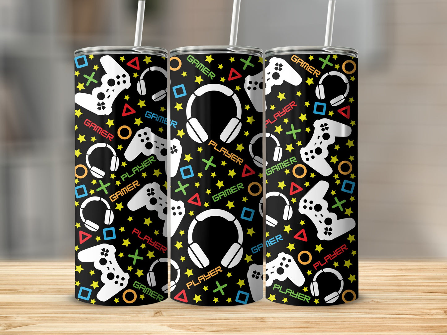 Black tumbler with white gamer controllers, headphones, and text.