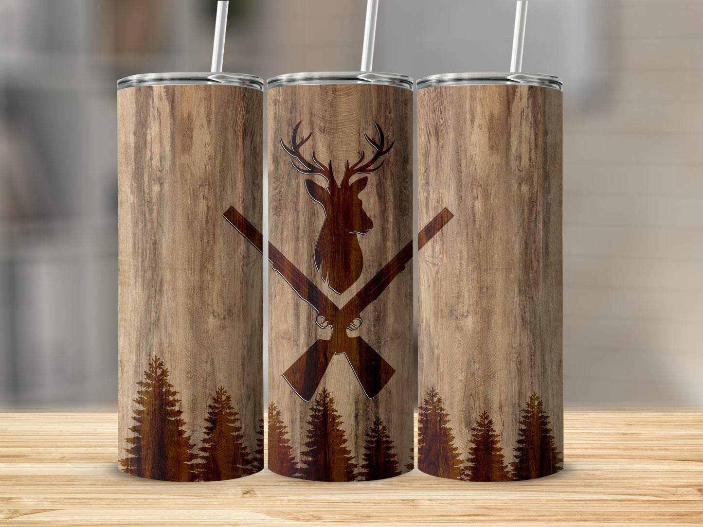 Three tumblers with wood grain, deer silhouette, and crossed rifles.