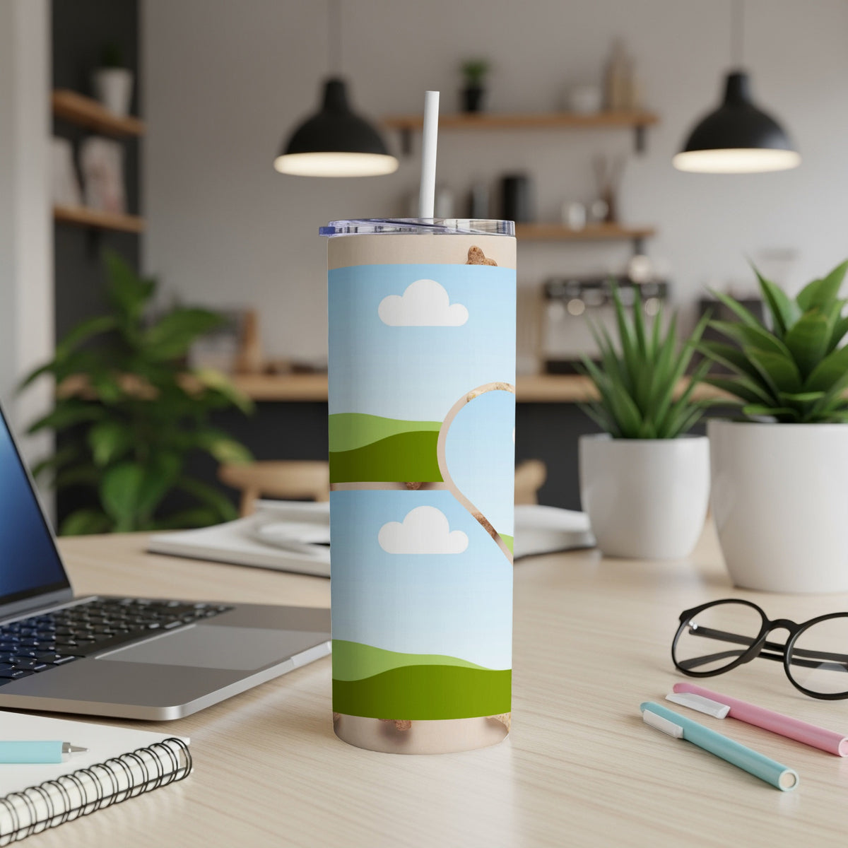 Tall tumbler with a sky and rolling green hills design, featuring a heart-shaped cutout.