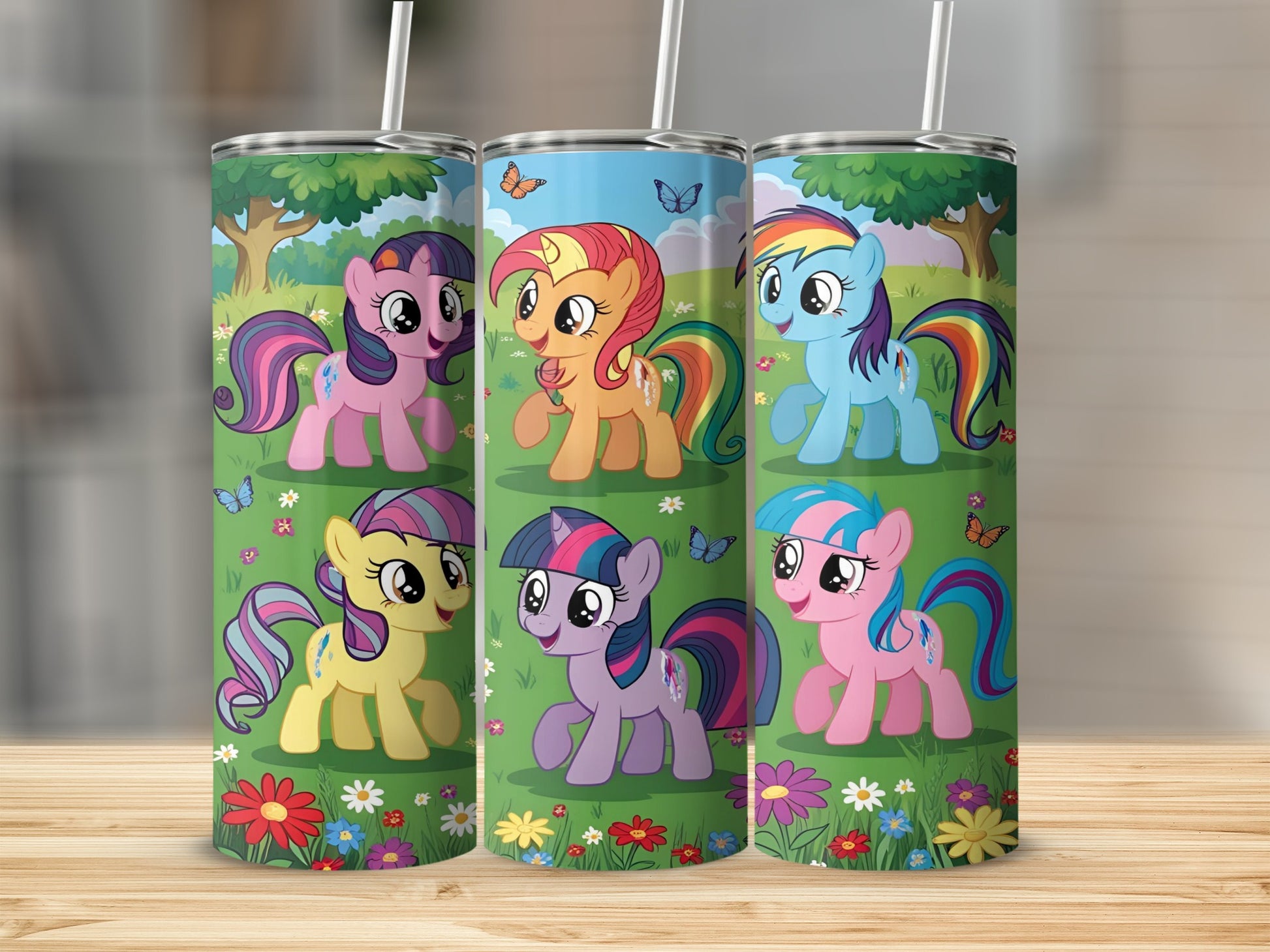 My Little Pony characters on a rainbow, floral, and grassy tumbler.