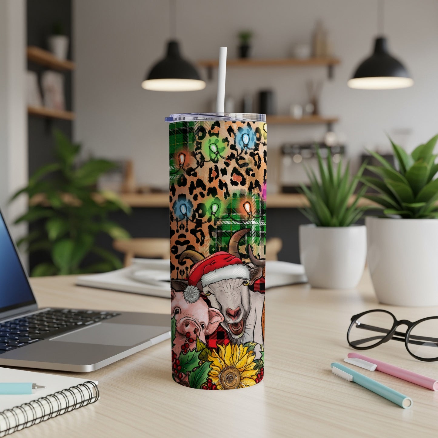 Christmas tumbler with pig, goat, and sunflower designs.