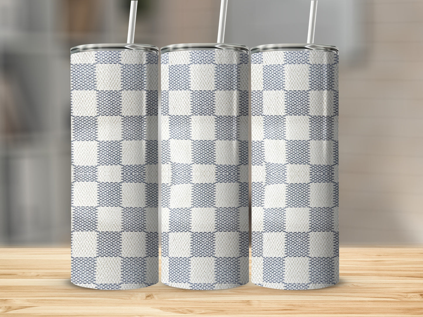 Three tumblers with a blue and white checkered pattern and straws.