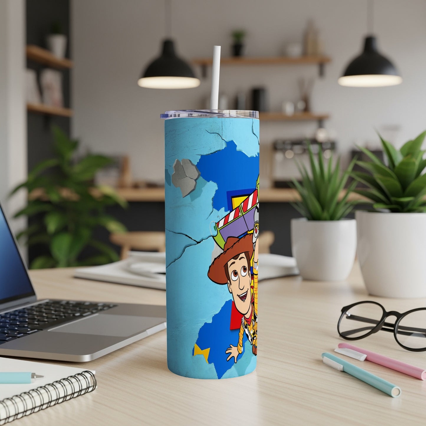Woody and Buzz Lightyear characters on a cracked blue tumbler with a straw.