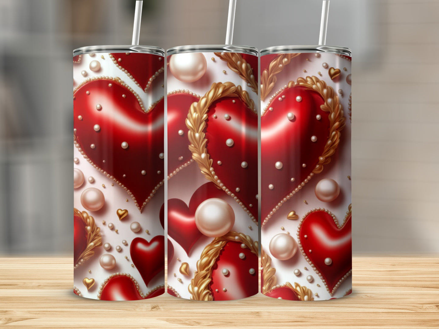 Three tumblers with a red heart and pearl design.