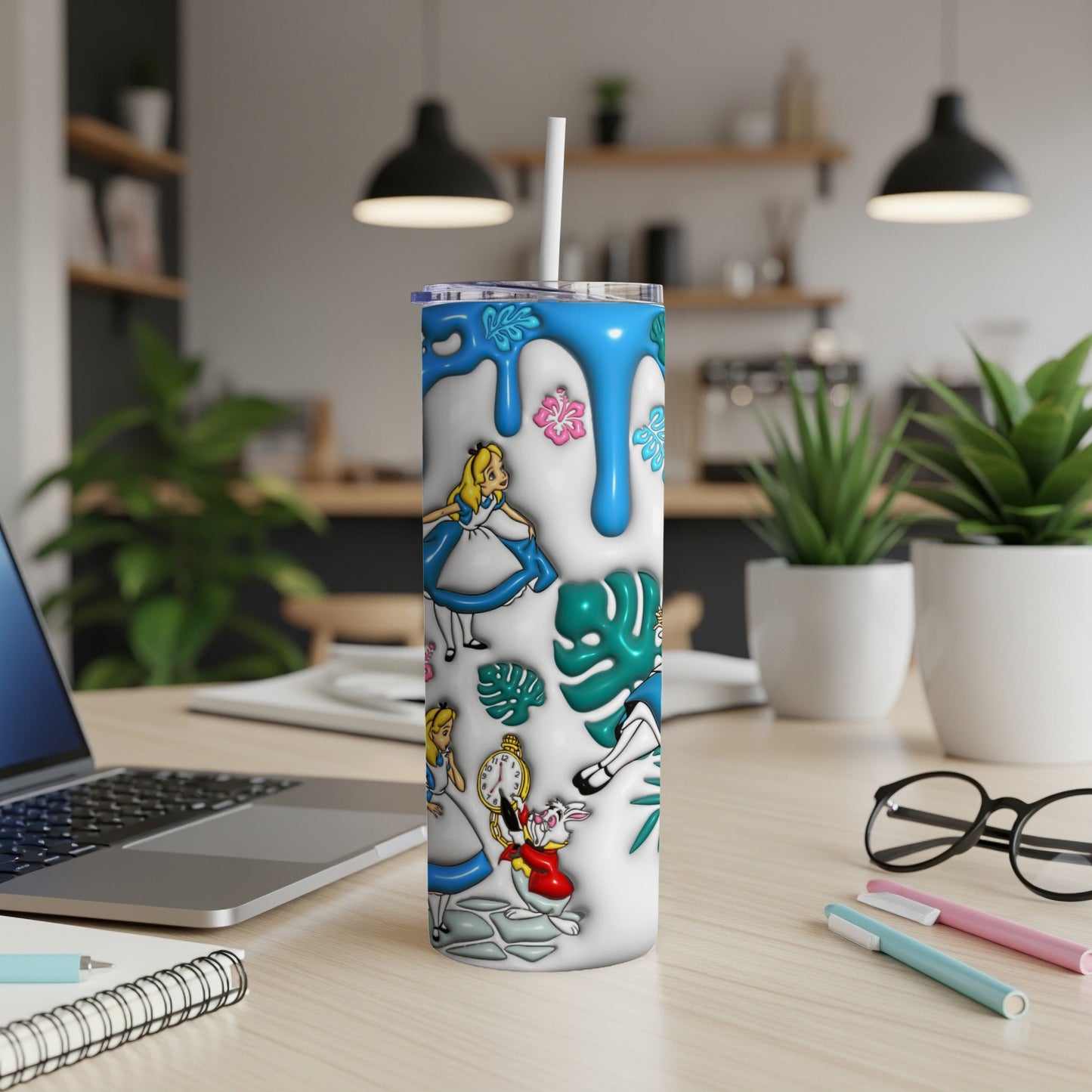 White tumbler with Alice in Wonderland characters and blue drip design.