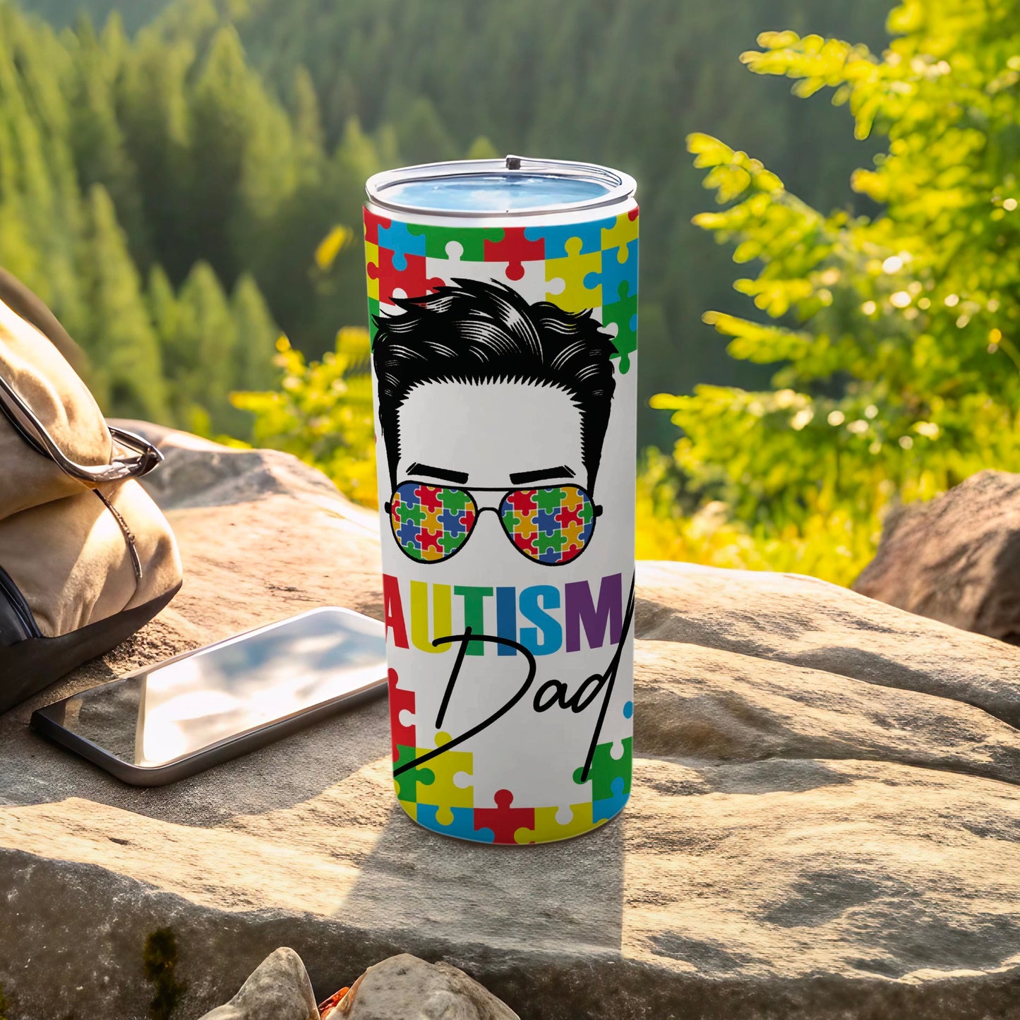 Tumbler with sunglasses and "Autism Dad" text in puzzle pieces.