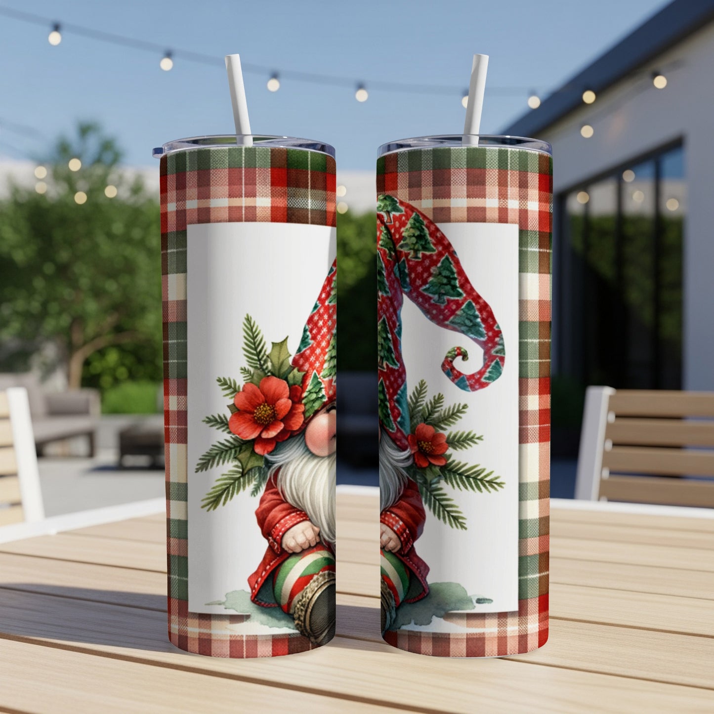 Two Christmas gnomes wearing festive hats on tumblers with plaid background.