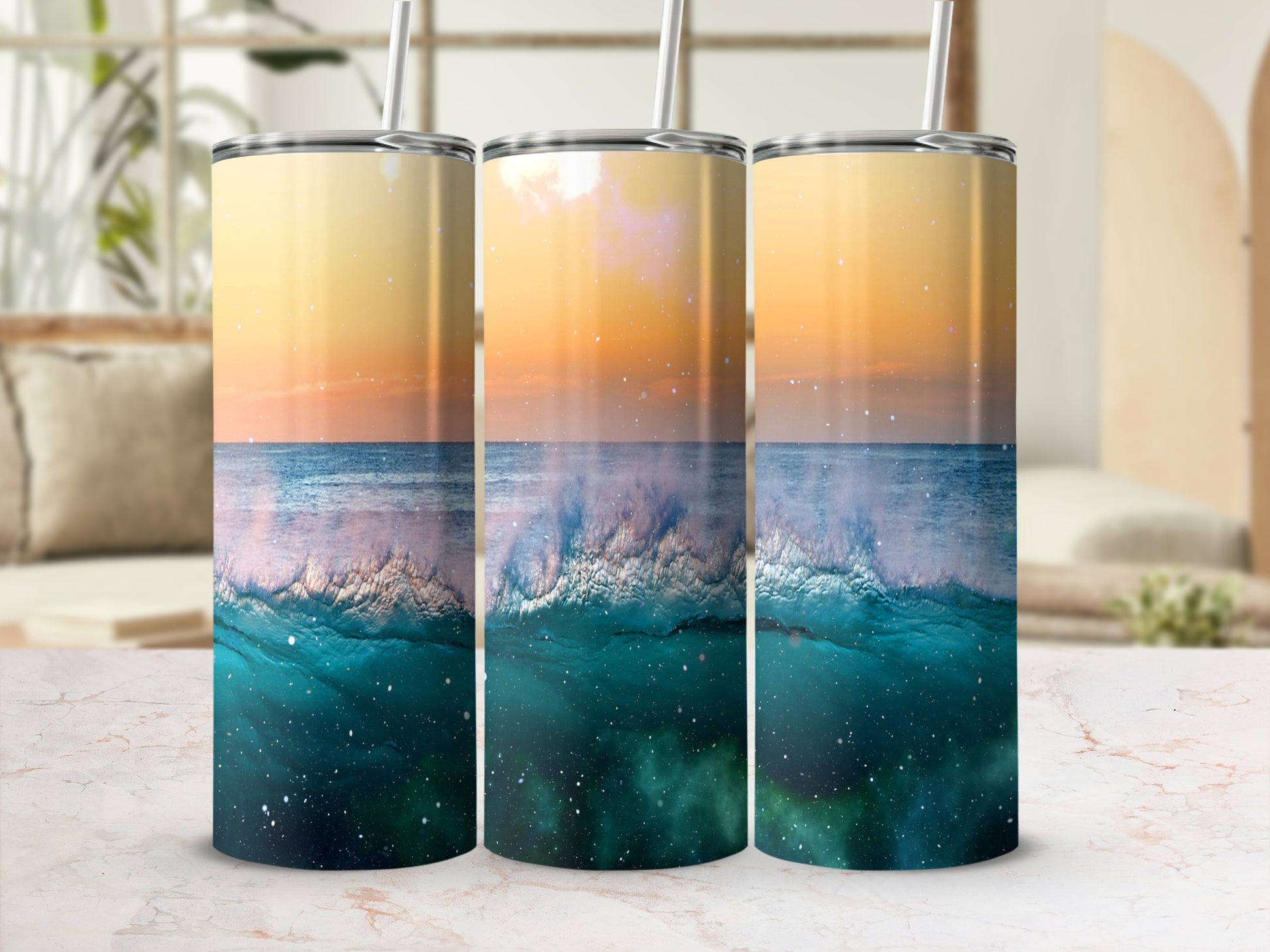 Three tumblers with ocean wave and starry sky design.