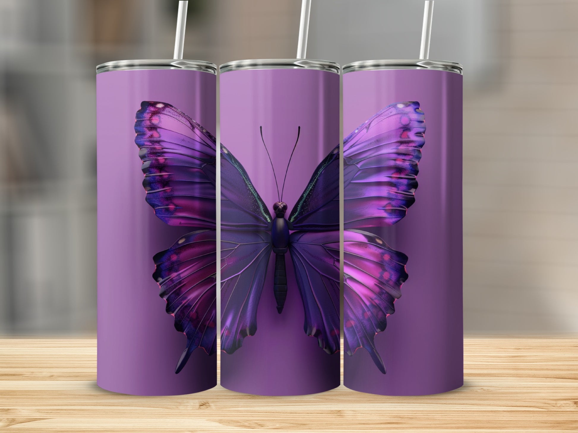 Purple butterfly design on three identical tumblers.