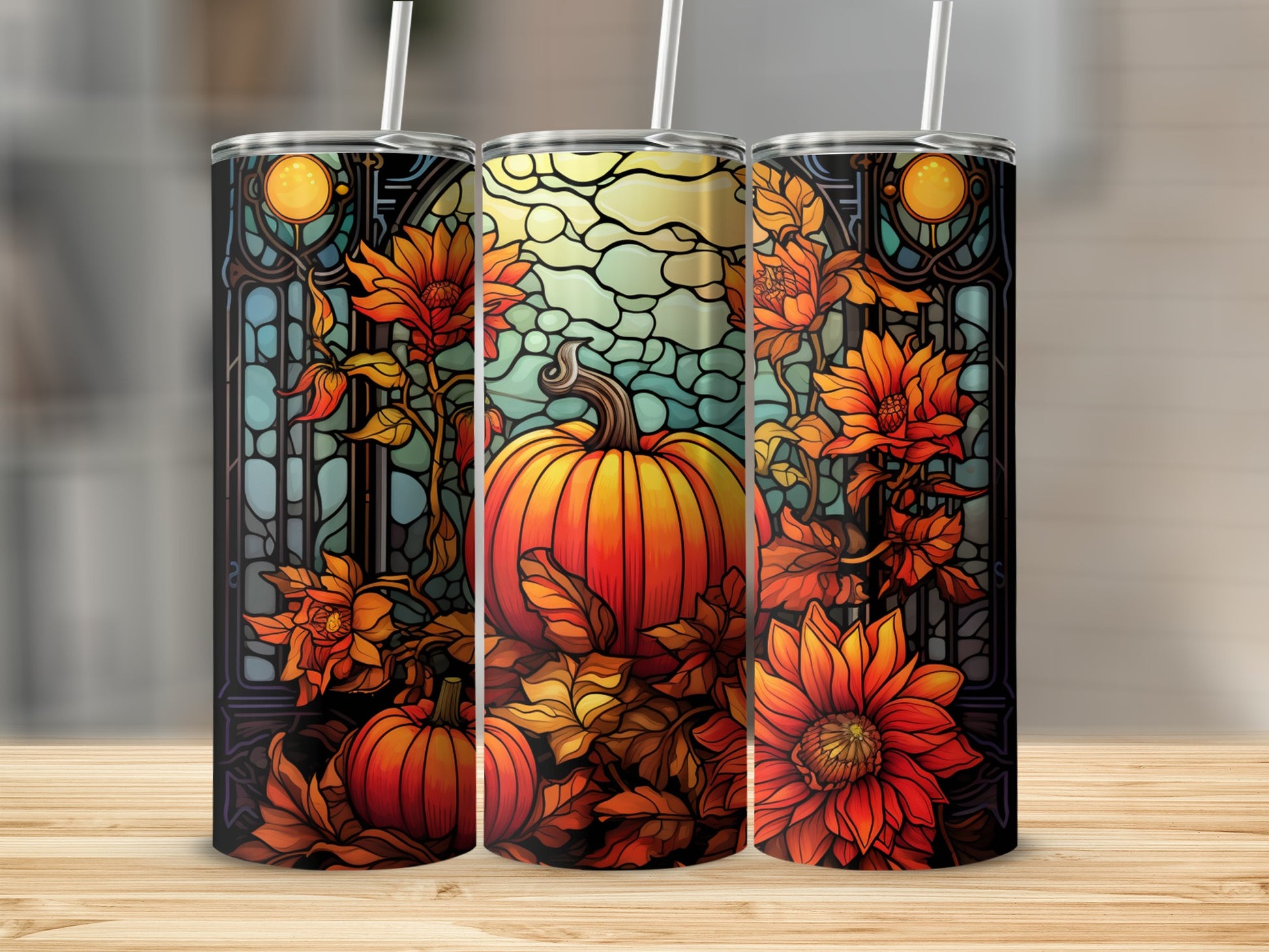 Three tumblers featuring a stained glass pumpkin and floral autumn design.