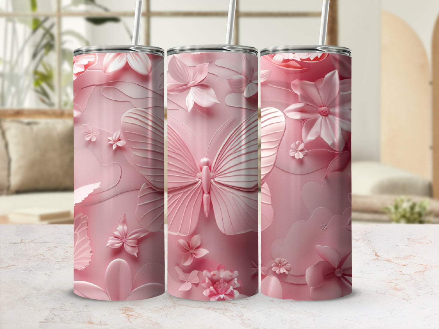 Pink tumbler with embossed butterfly and floral pattern.
