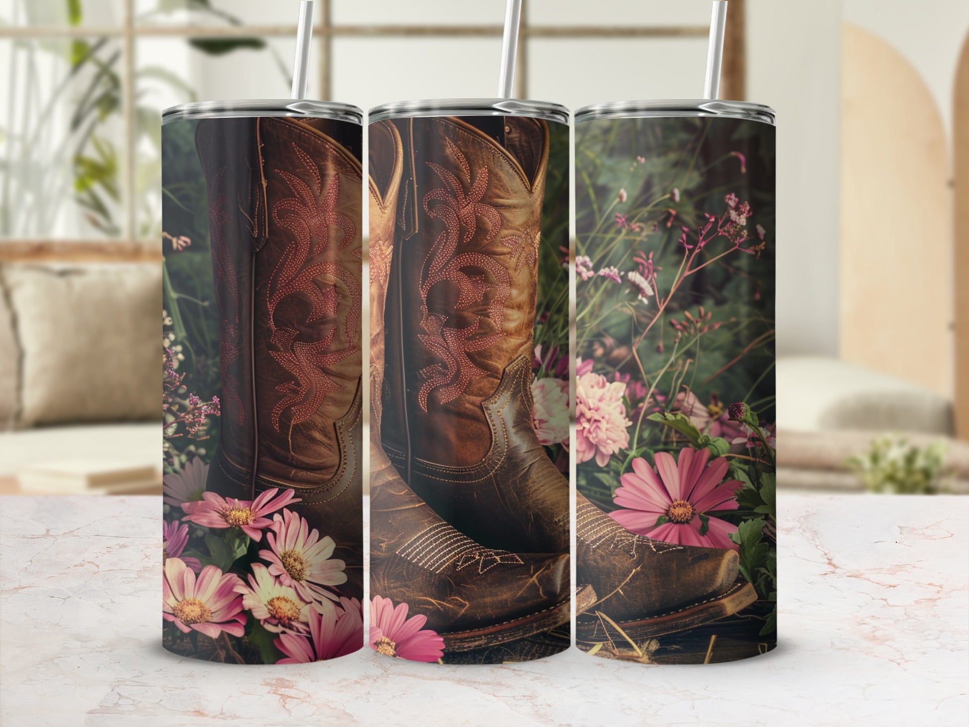 Brown leather cowboy boots with pink stitching nestled in pink wildflowers.