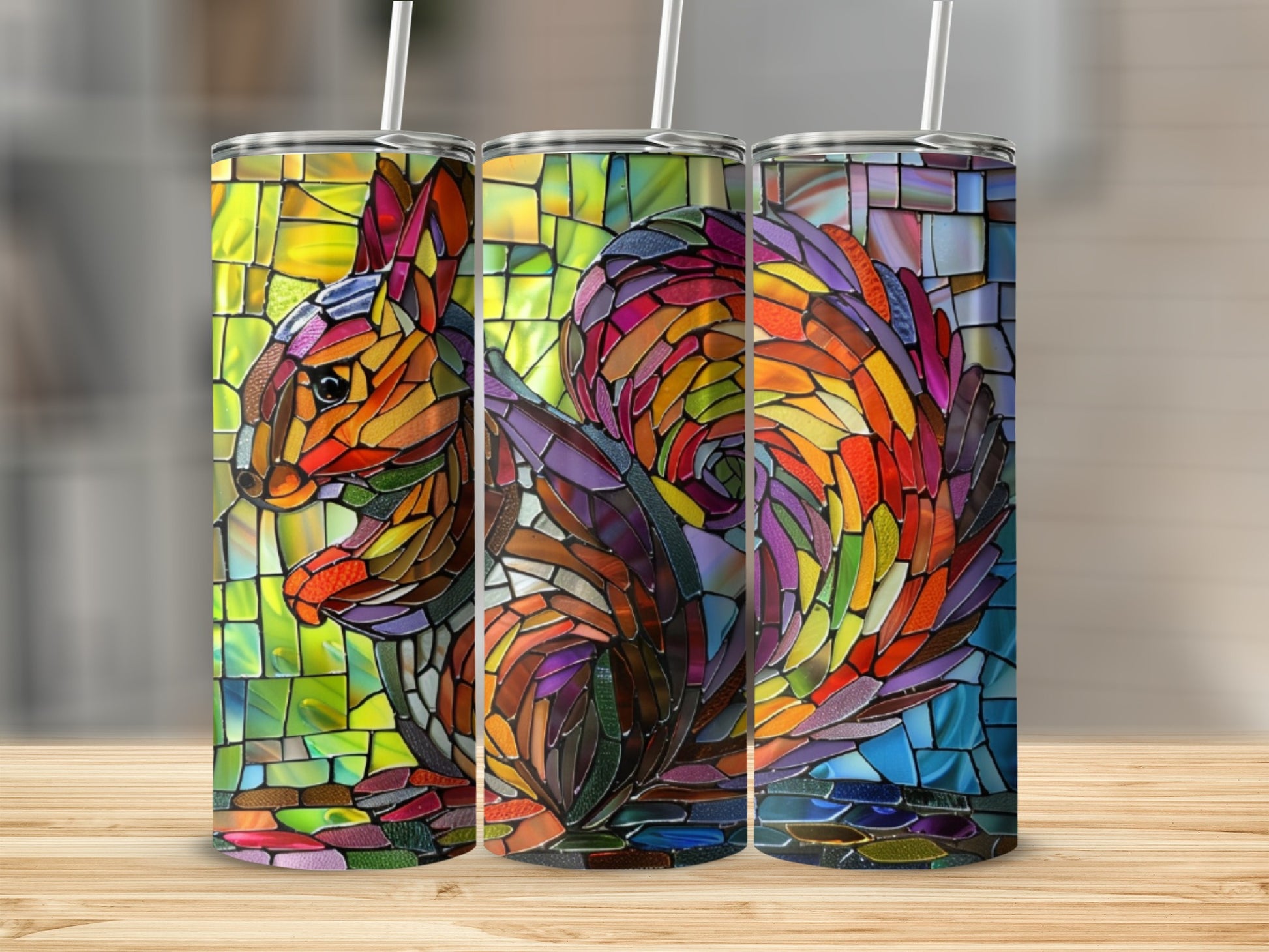 Triptych of a stained glass squirrel design on a tumbler.