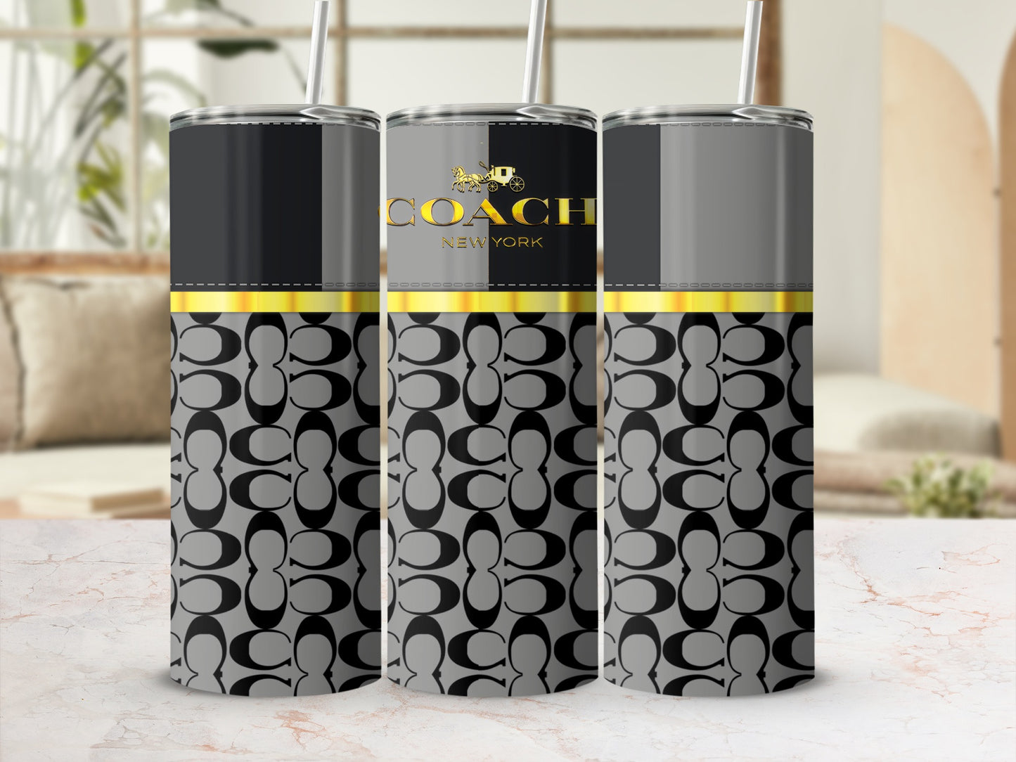 Coach New York logo on a gray and black tumbler with signature pattern.