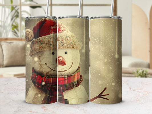 Snowman in Santa hat and plaid scarf with falling snow.