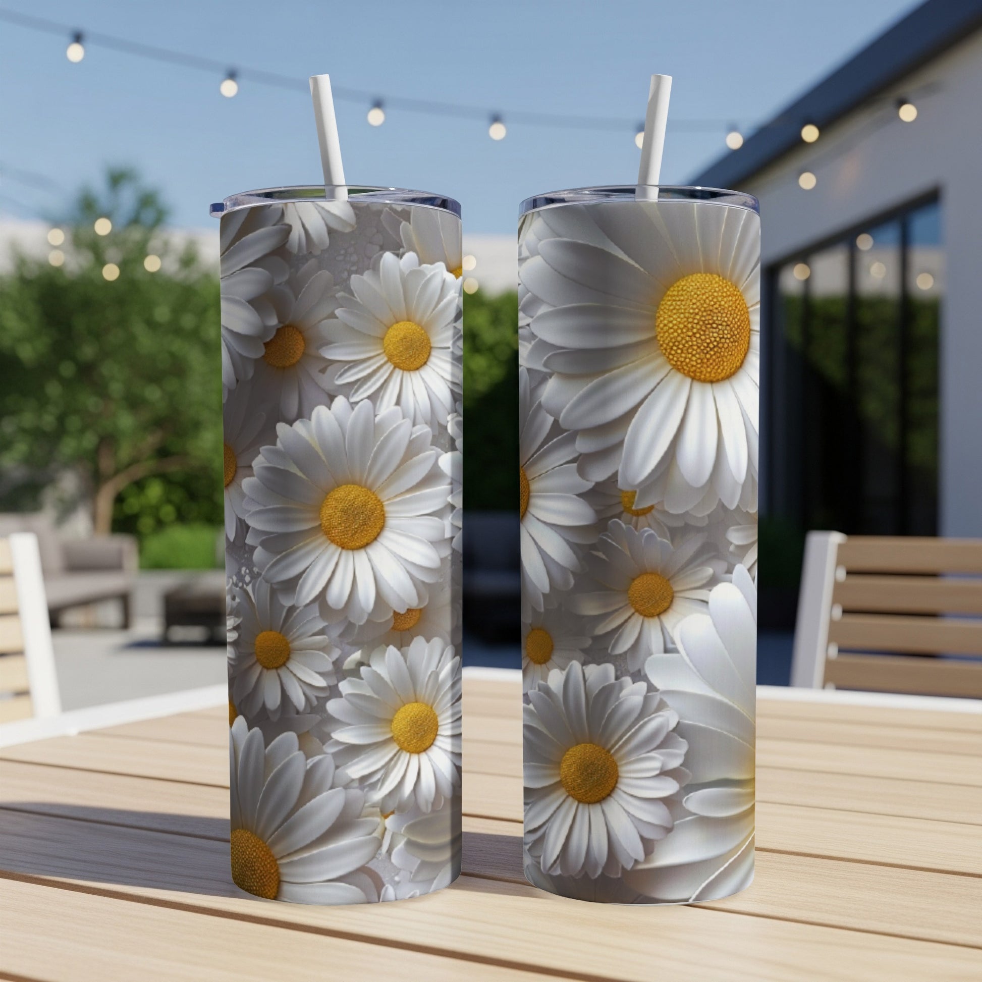 Two tall tumblers with a repeating daisy floral pattern.