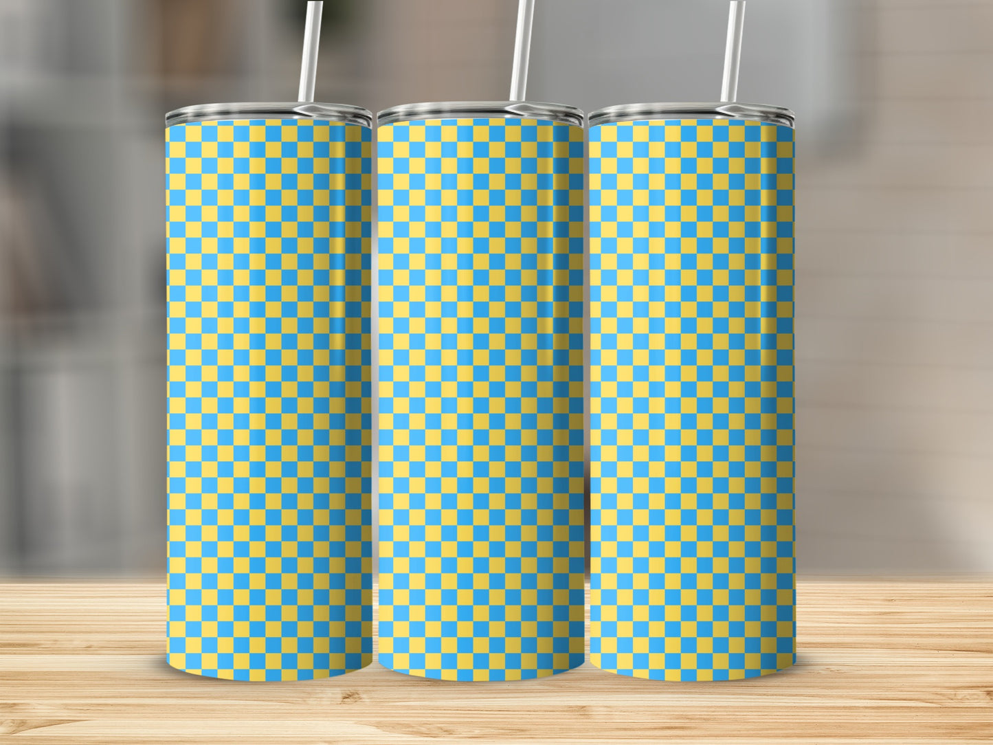 Three tall tumblers with a blue and yellow checkered pattern.