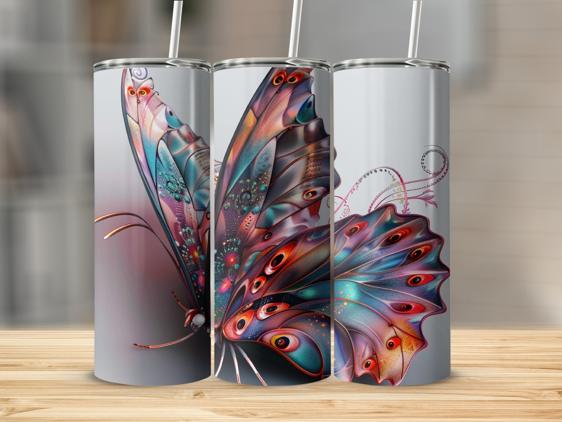 Three tumblers with a colorful, iridescent butterfly design.