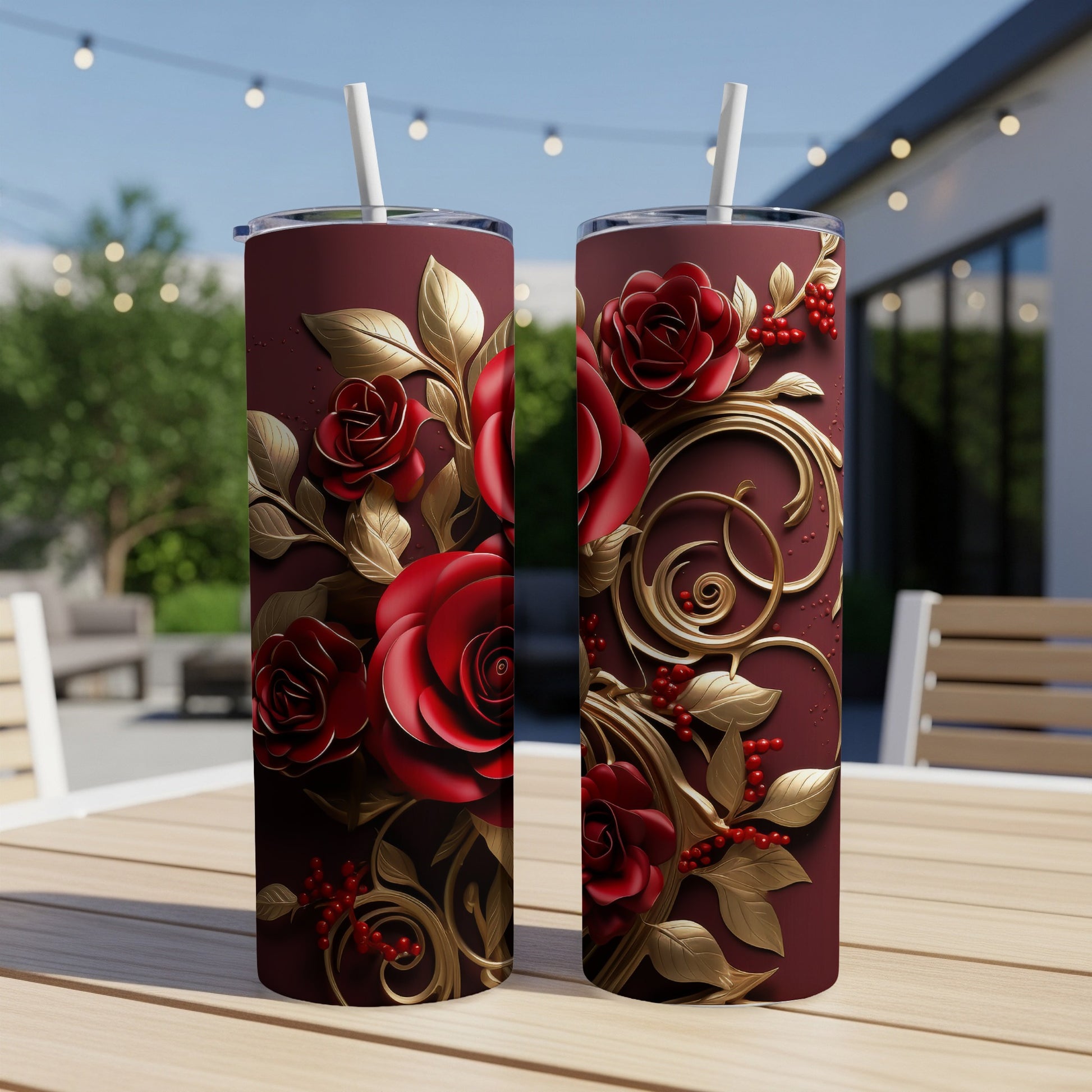 Two maroon tumblers with red roses and gold leaves design.
