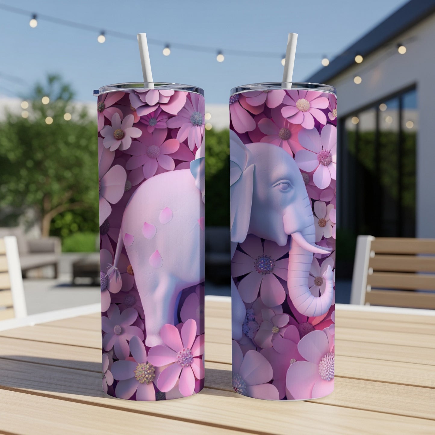 Pink elephant with floral pattern on a white tumbler with straw.
