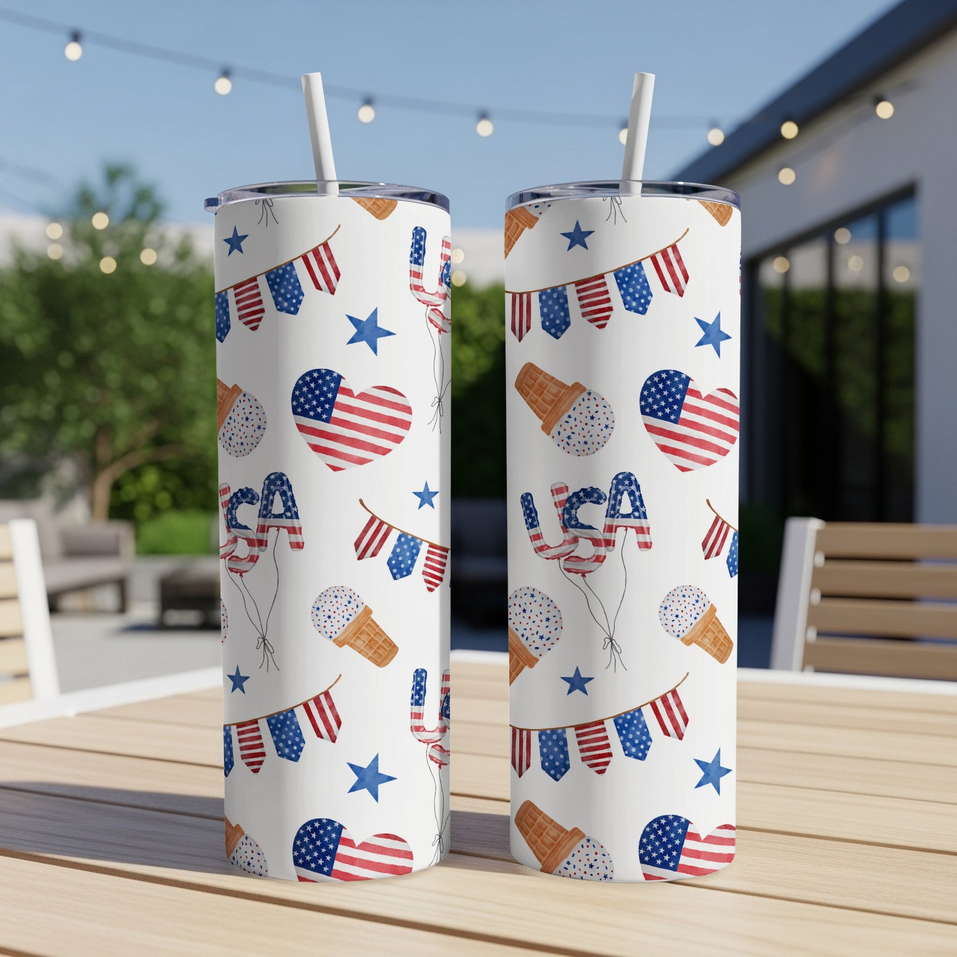 Two tumblers with patriotic USA-themed patterns of flags, hearts, and ice cream cones.