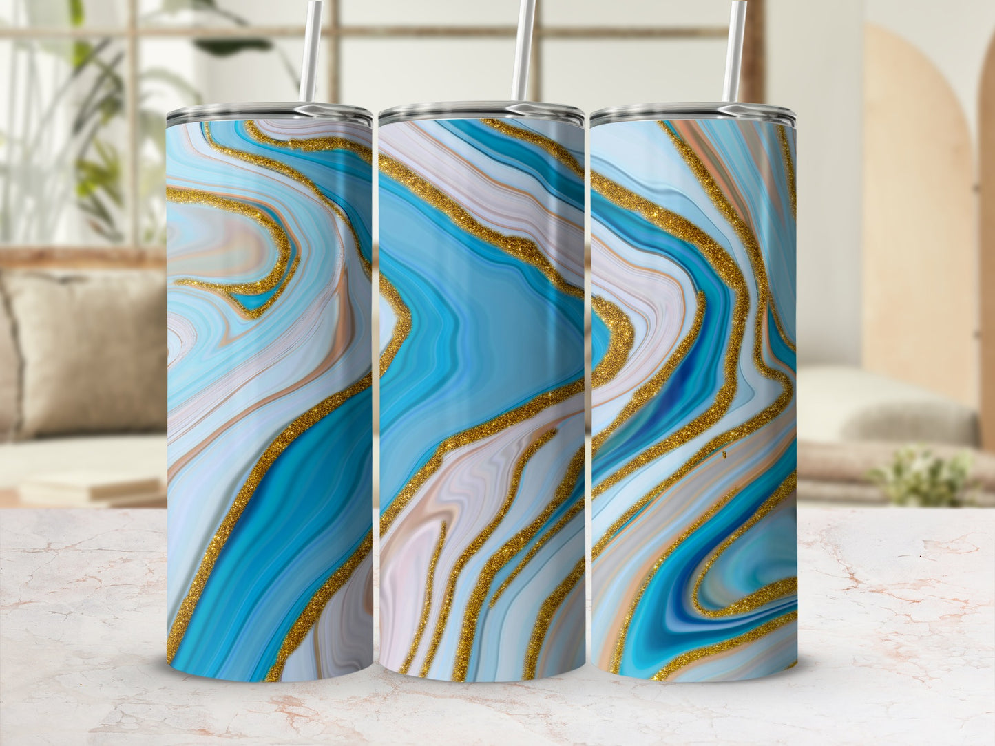 Three tumblers with a blue, gold, and white marbled design.