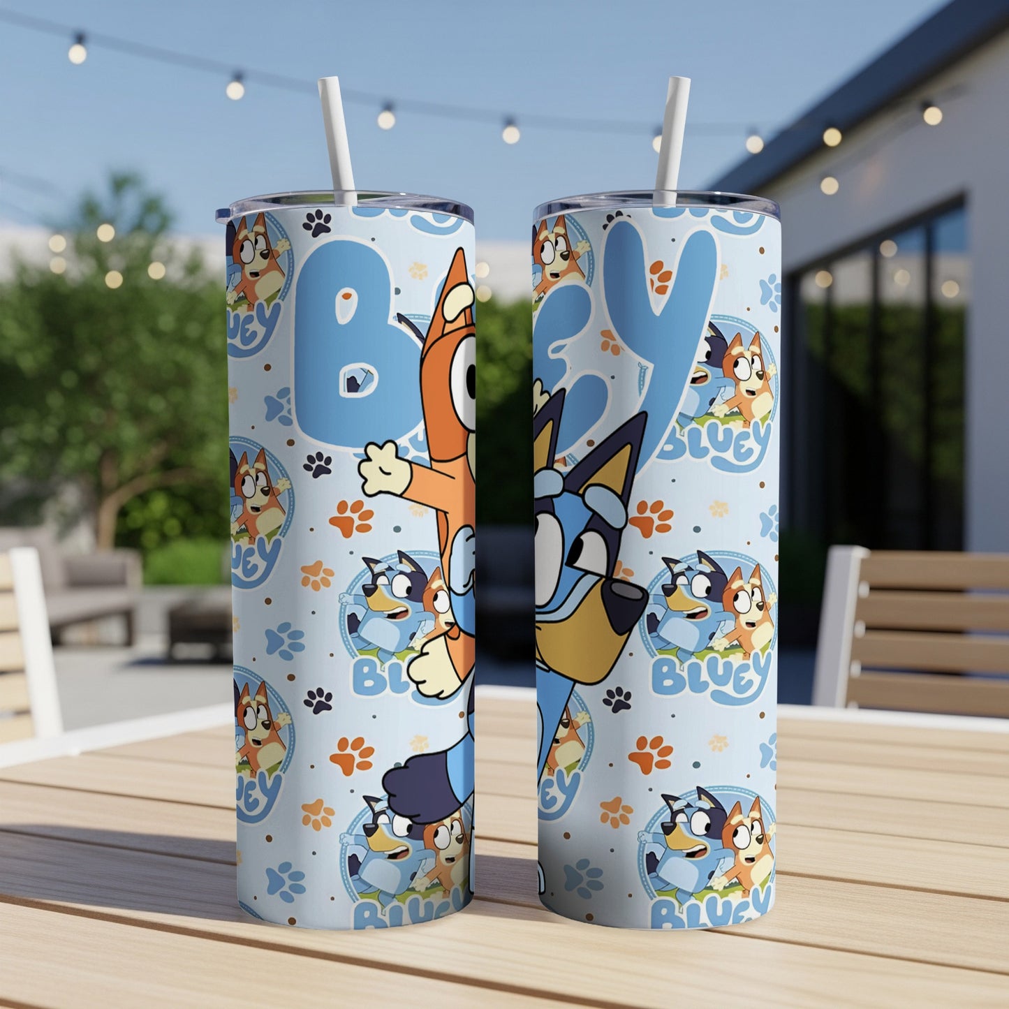 Bluey and Bingo characters on blue patterned tumbler with straws.