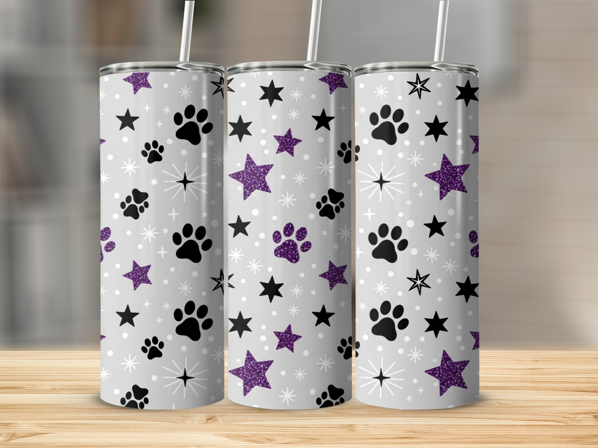 Three tumblers with paw prints and glitter stars pattern.