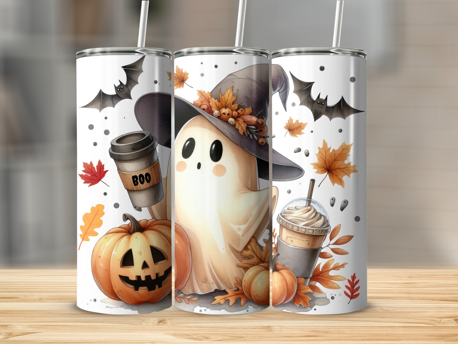 Three tumblers with Halloween ghost, pumpkin, and coffee cup designs.