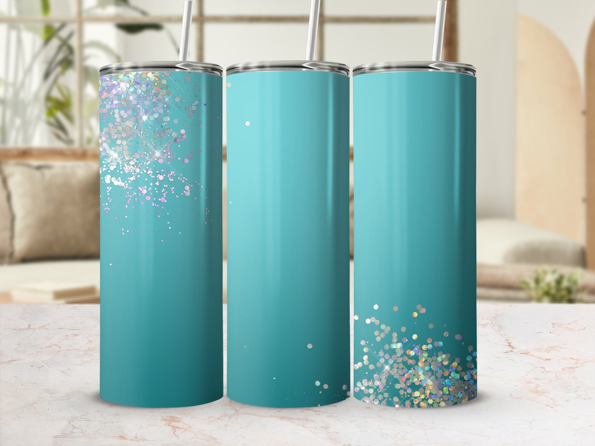 Three teal tumblers with glitter accents on the left and right tumblers.