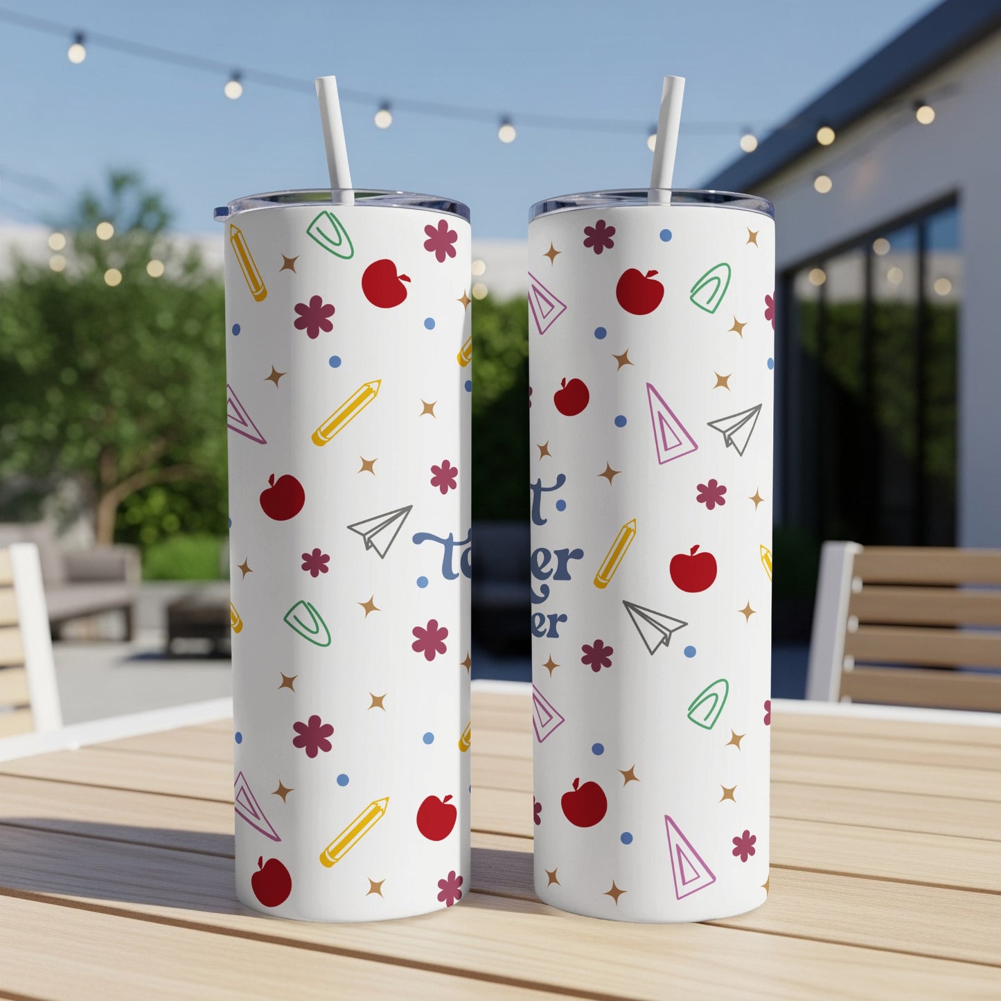White tumbler with colorful school supply pattern and "Best Teacher" text.