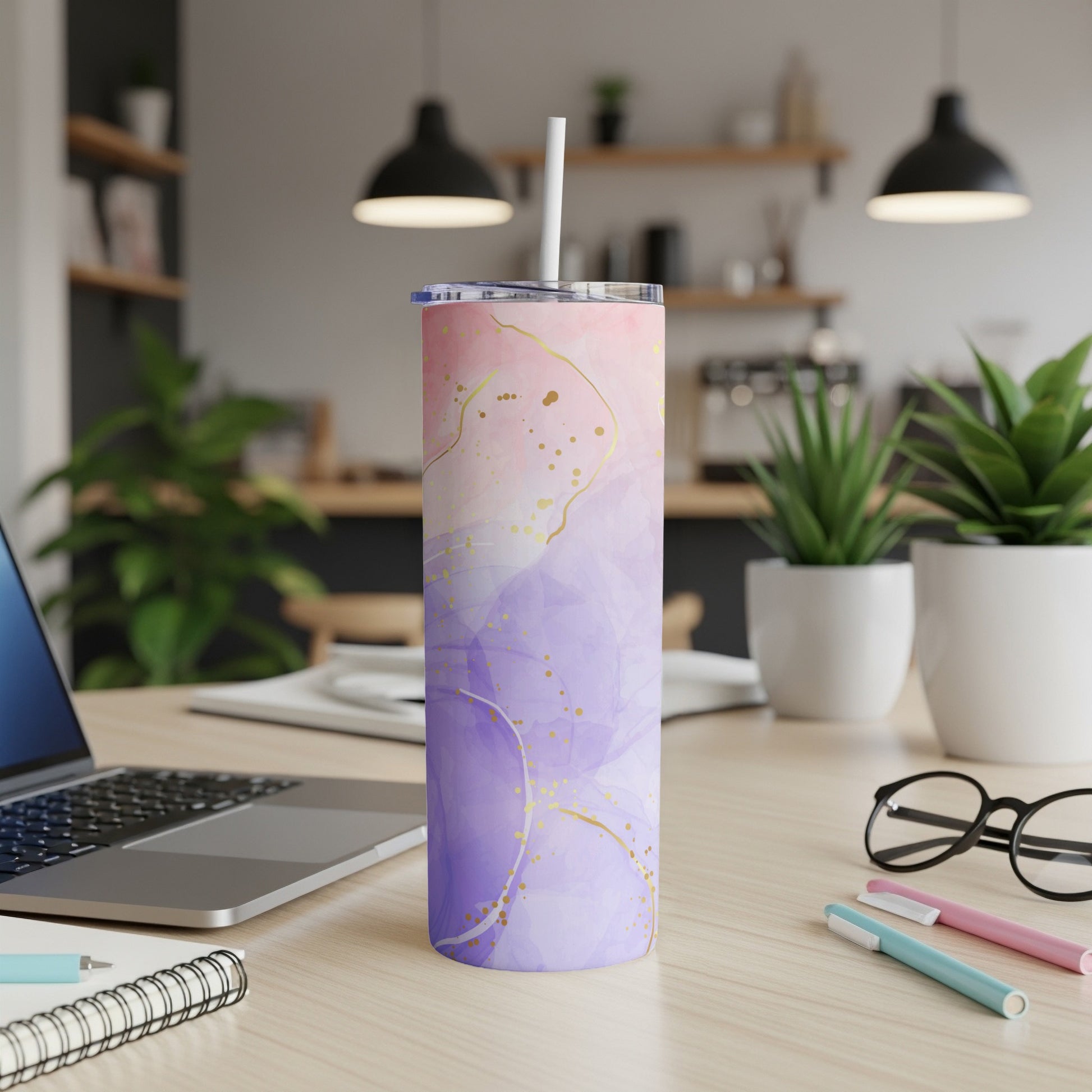 Purple and pink abstract watercolor tumbler with gold accents and straw.
