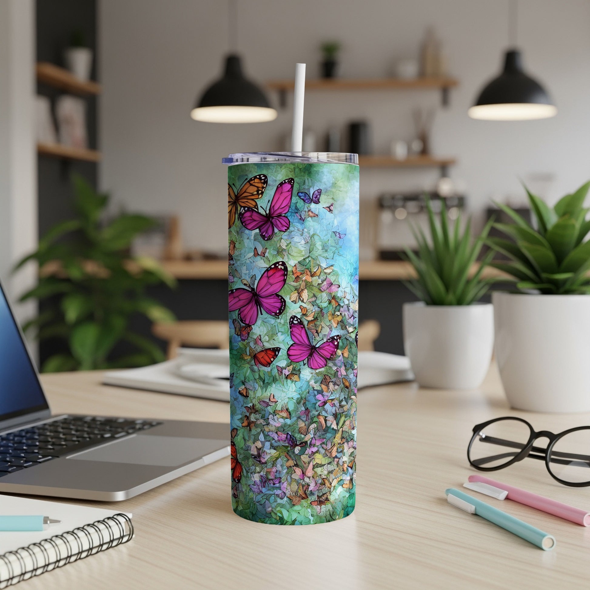 Tumbler with colorful butterflies on a vibrant green background.