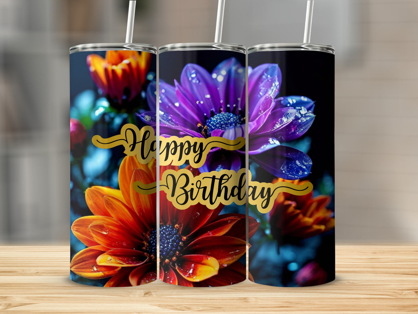 Three tumblers with purple and orange flowers, displaying "Happy Birthday".
