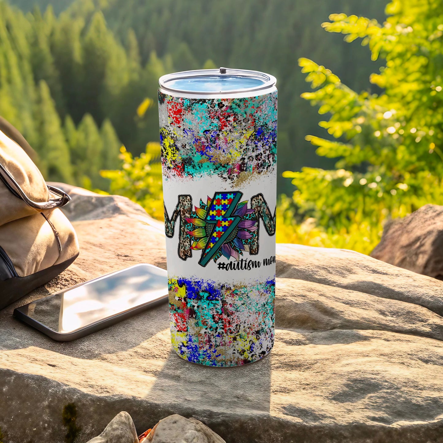 Colorful abstract art tumbler with "#autism mom" and a lightning bolt design.