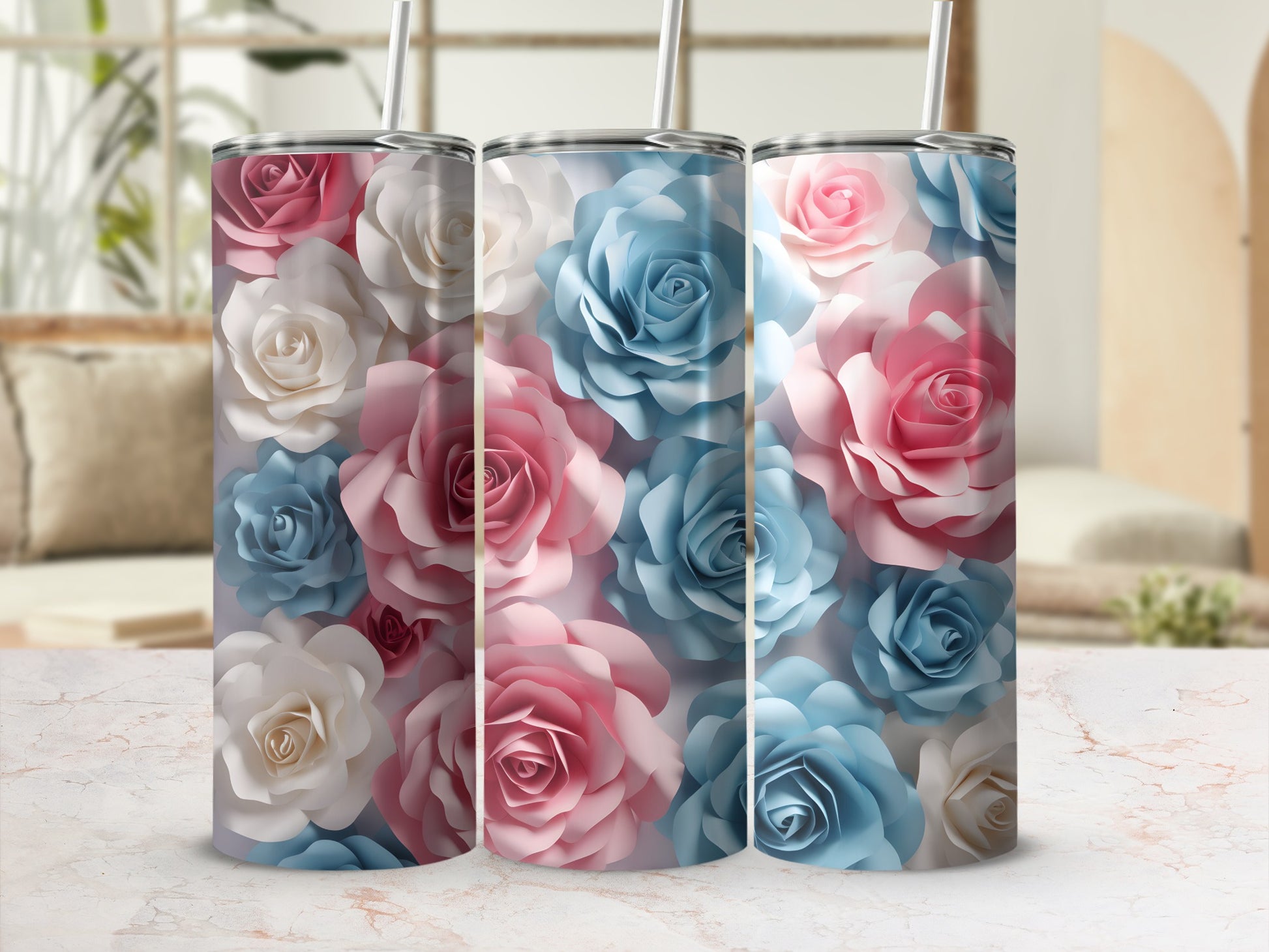 Three tumblers with a floral pattern of pink and blue roses.