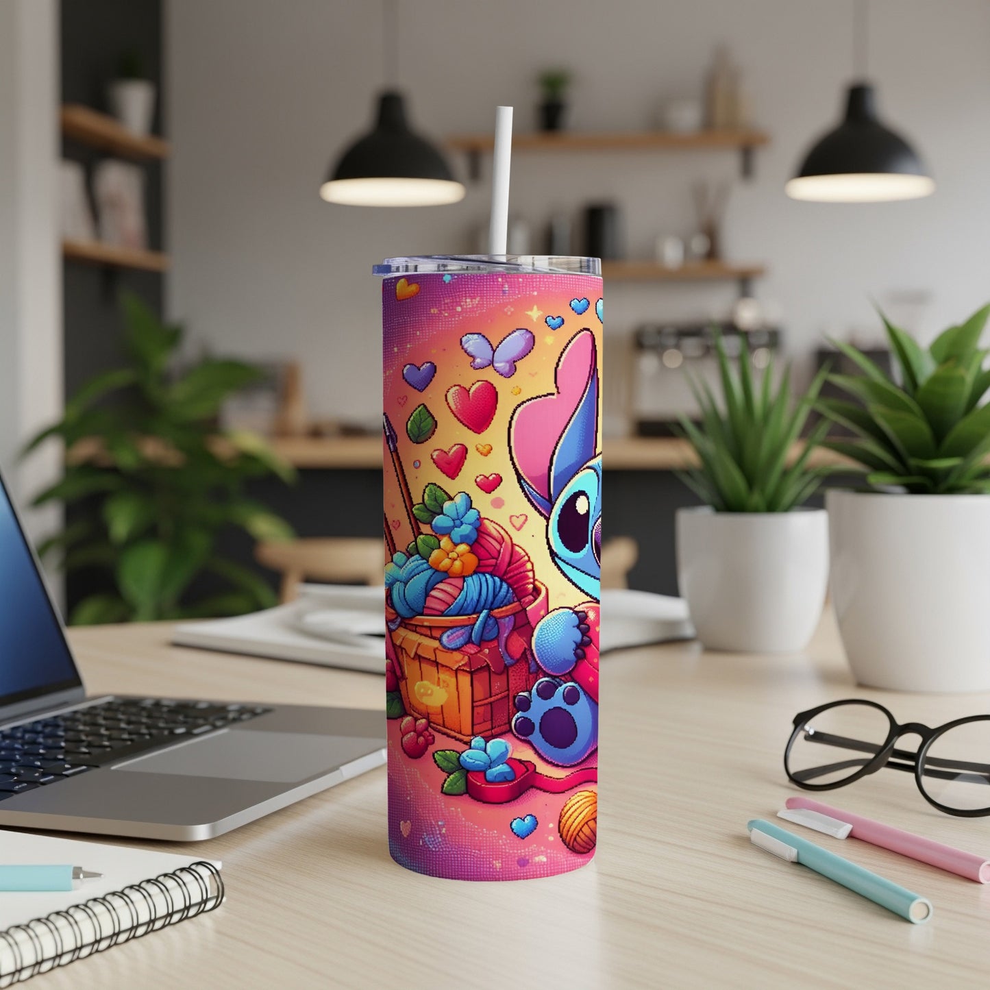 Stitch character design on a pink patterned tumbler with yarn and hearts.