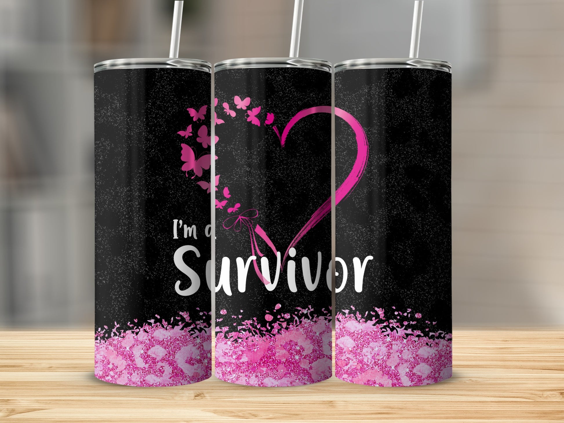 Black tumbler with pink breast cancer ribbon and "I'm a Survivor" text.