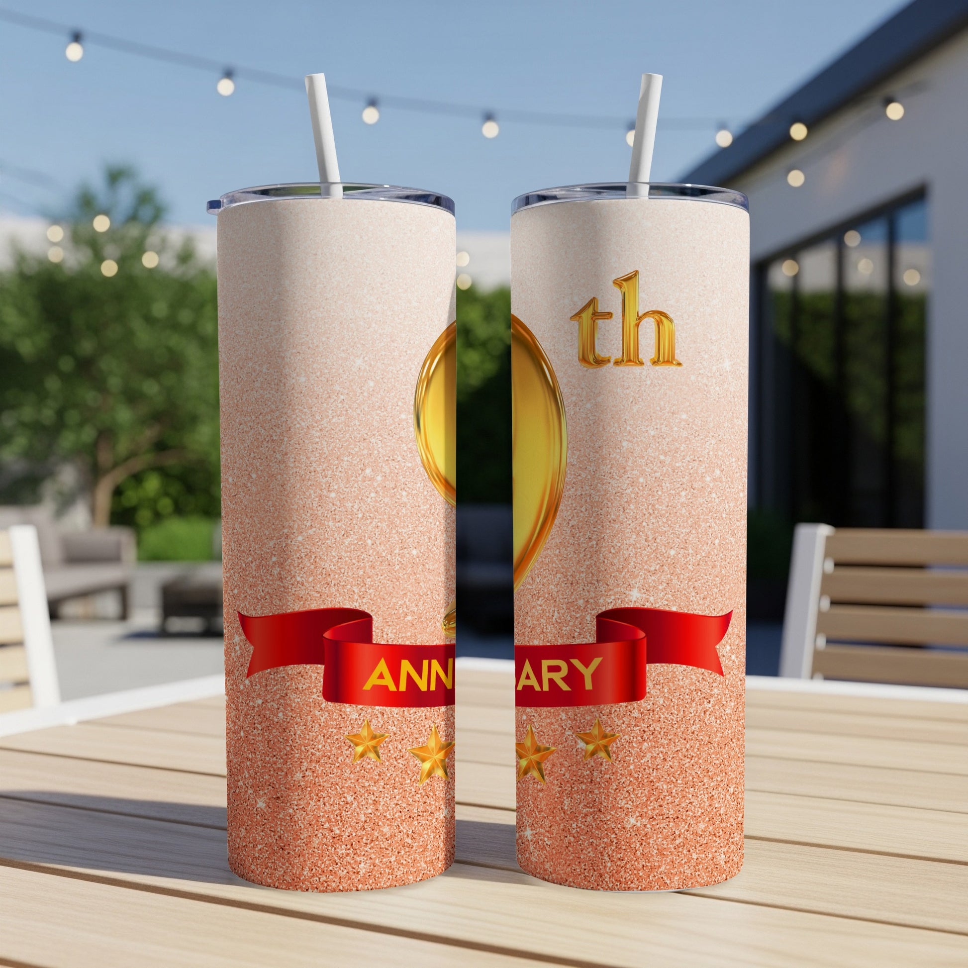 Two tall, glitter-covered tumblers with "Anniversary" and "th" text.