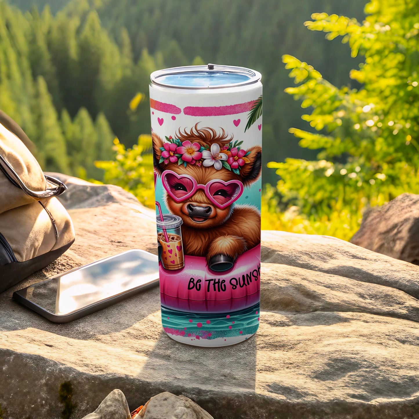 Cow wearing heart sunglasses and flowers on a tumbler with "Be the Sunny" text.